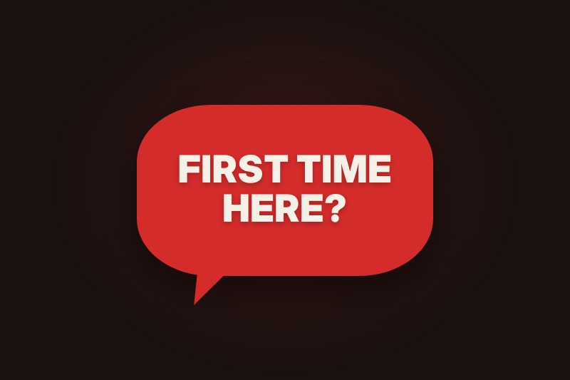 Eine rote Sprechblase mit dem Text: First time here?